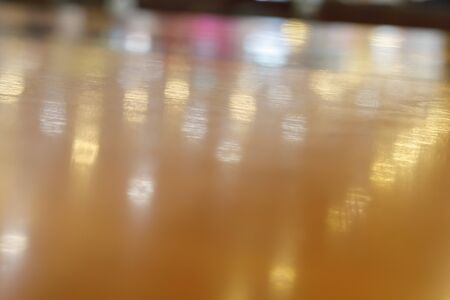wooden table empty of display in cafe with luxury light decoration for dinner celebration