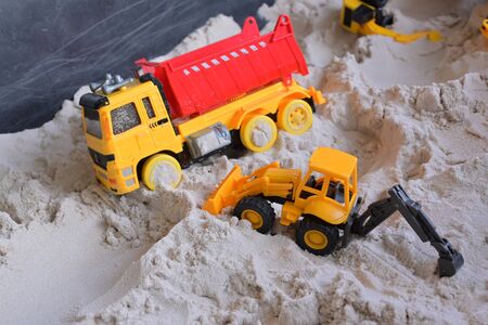 small kid toy vehicle construction in sand playgroundの写真素材