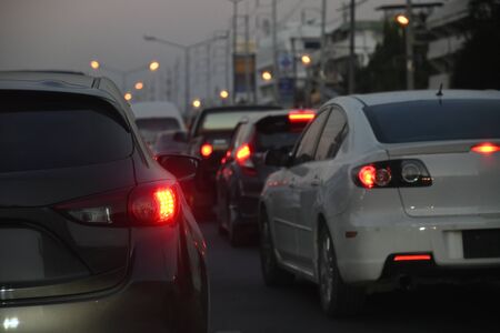 traffic jam on night road, car driving in rush hour of city lifeの写真素材