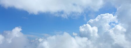 panorama image, fluffy white cloud moving above dream sky backgroundの写真素材