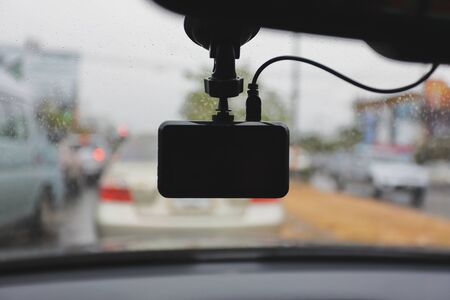 video camera recorder inside car driving rainy dayの写真素材