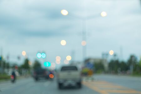 car driving on urban road trip travel, image blur backgroundの写真素材