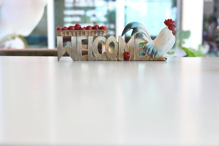 sign board carving from wooden with welcome word and chicke use for decorationの写真素材