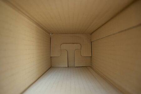 empty inside brown paper box carton for package delivery goodsの写真素材