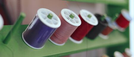 shelf of colorful thread set material for sewing embroidery