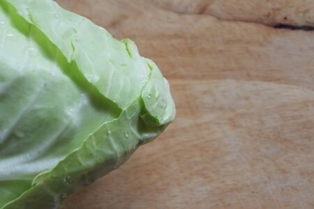 fresh cabbage organic vegetable put on wooden cutting board in kitchen prepare cooking foodの写真素材