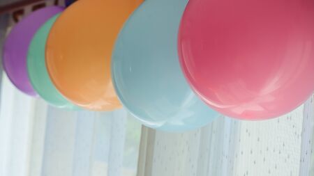 colorful pastel balloon hanging decoration in birthday celebration party backgroundの写真素材