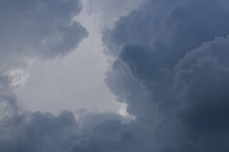 dark heavy storm cloud on dramatic moody skyの写真素材