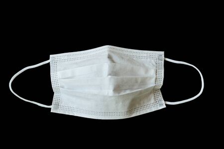 medical hygiene face mask isolated on black backgroundの写真素材