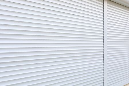white roller shutter door closed security in modern house
