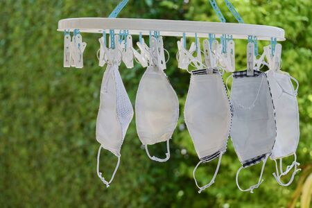 washing clean fabric mask hanging dry disinfect for wearing reuseの写真素材