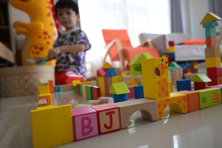 wooden toy block building town for activity of kid play learning development in homeの写真素材