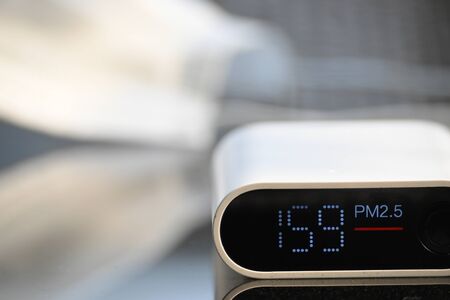 automatic measuring monitor of air dust pollution pm2.5 with unhealthyの写真素材