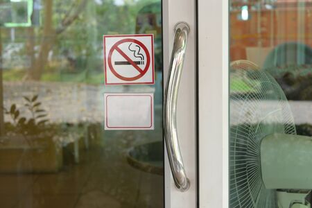 stainless steel handle on glass doorの写真素材