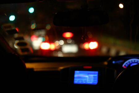 traffic jam on night road, image blur light of car in the cityの写真素材