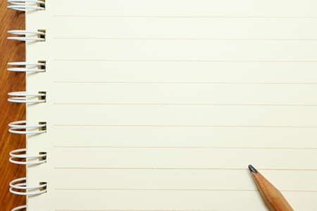 wood pencil on white notebook