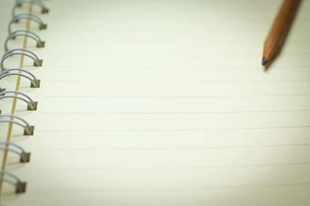 wood pencil on white notebookの写真素材