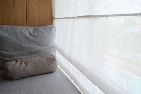 gray pillow put on balcony