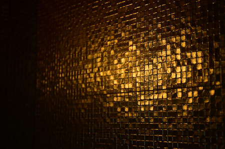 mosaic wall texture background with lightの写真素材