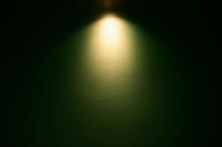 dark green wall and warm electric light, interior design