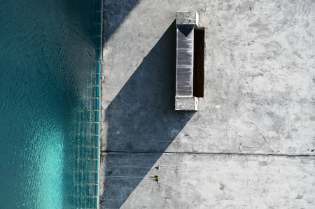 faucet of swimming pool on cement wall, construction industry