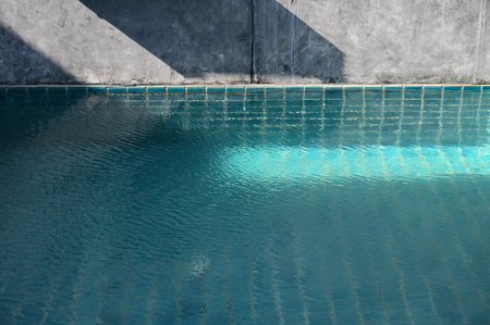 blue swimming pool and cement wall, construction industryの写真素材