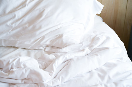 white bed and pillows in the room