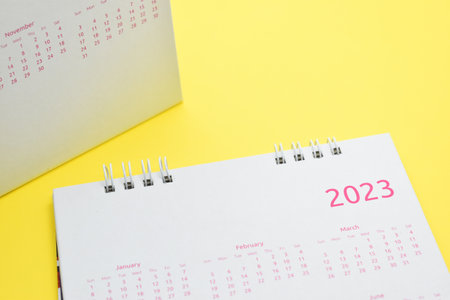white calendar 2023 on yellow backgroundの写真素材