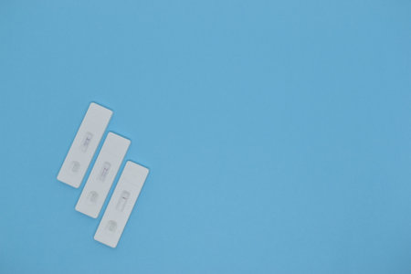 covid test kit on blue backgroundの写真素材