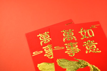 red envelope for chinese day on red backgroundの写真素材