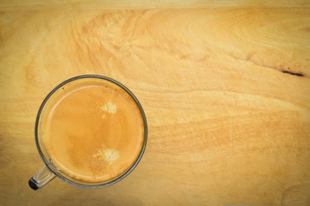 glass of hot black coffee put on wood backgroundの写真素材