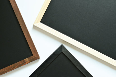 blank clean new chalkboard in wooden frame isolated on white background, blackboard for education...