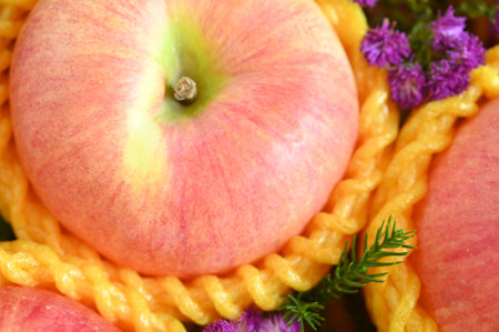 close up pink apple in yellow wrap bubble, healthy foodの写真素材