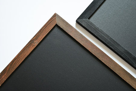 blank clean new chalkboard in wooden frame isolated on white background, blackboard for education schoolの写真素材