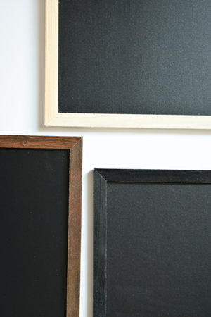 blank clean new chalkboard in wooden frame isolated on white background, blackboard for education...