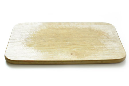 brown wooden cutting board isolated on white background, plank wood for cooking in the kitchenの写真素材