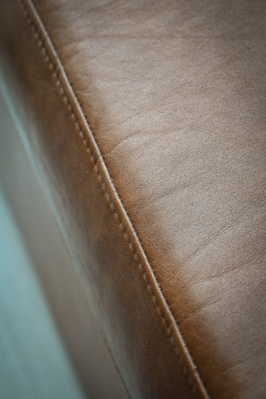 vintage brown leather sofa texture backgroundの写真素材