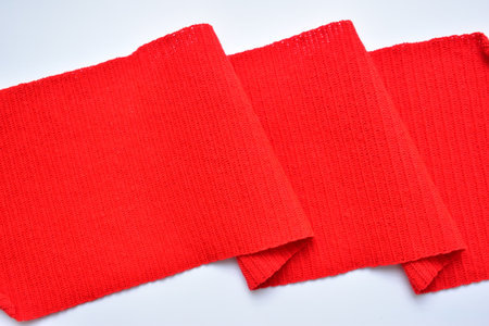 wavy of red wool knitted yarn texture, woolen fabric on white background