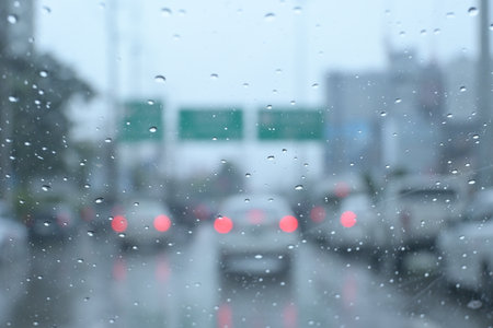 traffic on highway with cars on rainy day, blur background