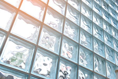 close up glass block wall with golden natural light background, interior designの写真素材