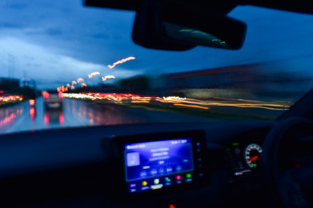light of car on road in the night, blurred background with rain