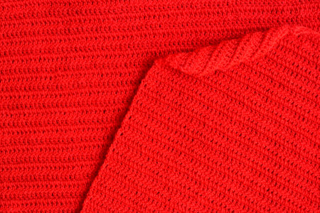 overlap of red wool knitted yarn texture, woolen fabric background