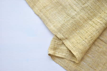 torn sackcloth isolated on white background, burlap fabric texture for design
