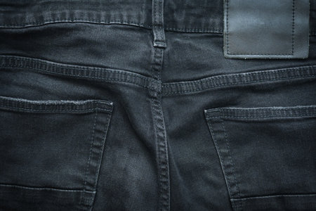 black denim clothing texture background, textile of pants fashion