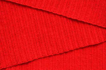 overlap of red wool knitted yarn texture, woolen fabric background