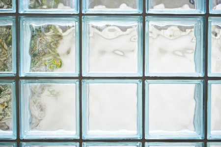 close up glass block wall with golden natural light background, interior design