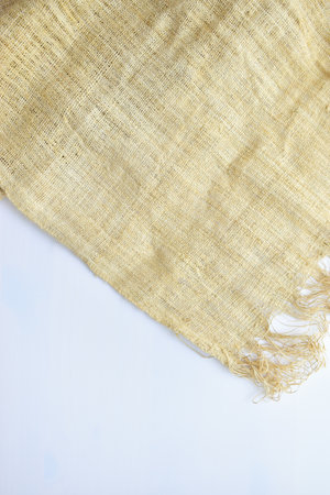 torn sackcloth isolated on white background, burlap fabric texture for design