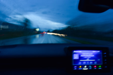 light of car on road in the night, blurred background with rainの写真素材