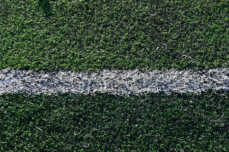 artificial green grass soccer field with white line