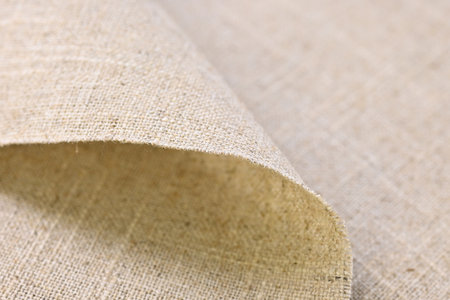 brown hemp viscose natural fabric cloth, sackcloth rough texture of textile fashion abstract backgroundの写真素材